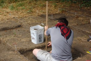 Measuring the depth of the trench.