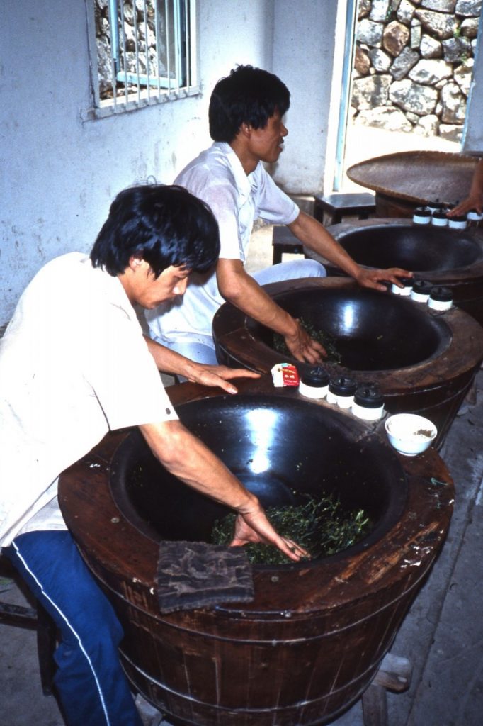 Workers_heat_tea_leaves_in_tourist_area_of_Chinese_plantation