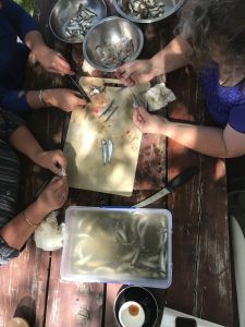 Filleting fish with Lyndal, Mel, and Kate.