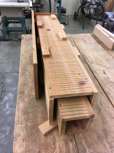 Each piece of wood needs to be perfectly placed in order to fit the top square piece of wood into place.