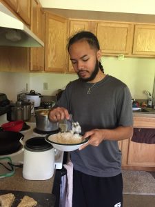 Roquin preparing a bowl of food.