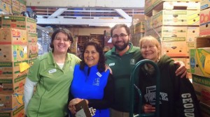Carol Linnebur pictured with Debbie Garrington, Nate Bernitz, and Givhan Williams while spending an afternoon working at Thurston County Food Bank.