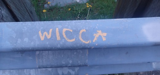 "Wicca" written in yellow on a guard rail