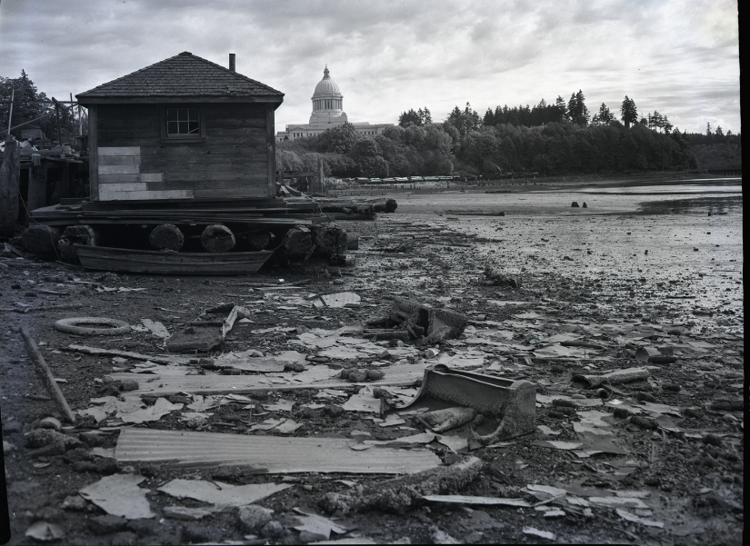 black and white photo of float house in mud