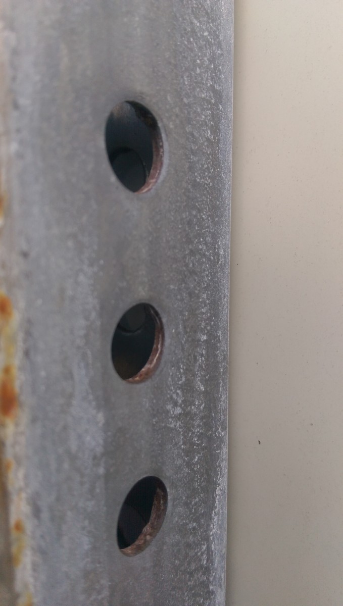 This stood out to me. It was the first thing I noticed when approaching the park sign from behind. The obvious, large white on the back of a "No Parking" sign.