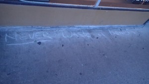 street chalk text reading "never waste a boner"