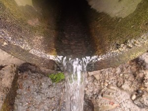 Drainage pipe draining water in the inlet.