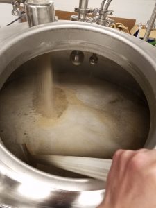 Mixing the ground barley into the water. One of the first steps to making any beer. 