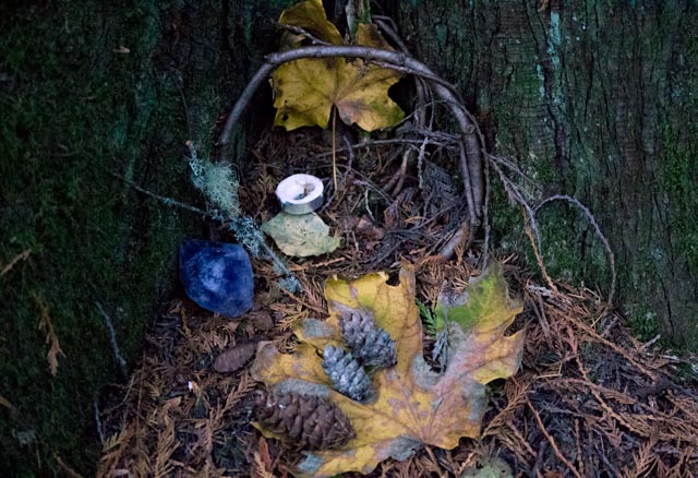 Here is the shrine when I added some leaves, pine cones, and my amethyst.